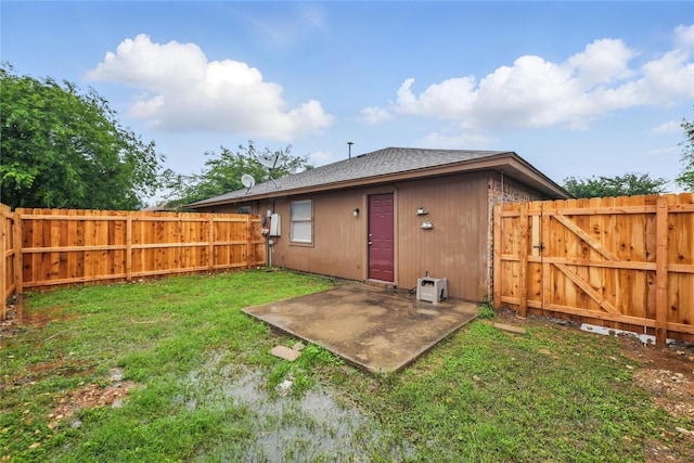 6708 S Creek Dr, Fort Worth, TX 76133 - back of house with a patio area, a shingled roof, and a gate