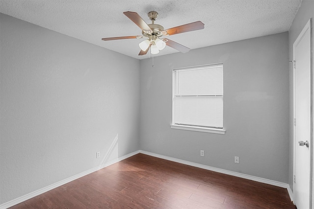 6708 S Creek Dr, Fort Worth, TX 76133 - spare room with dark wood-type flooring, ceiling fan, a textured ceiling, and baseboards