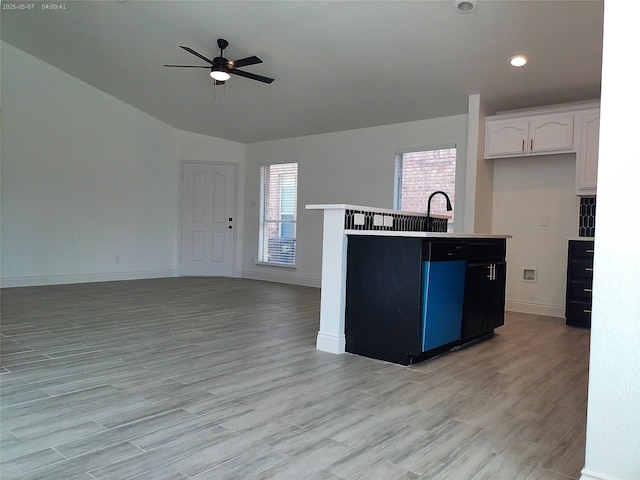 6025 Melanie Dr, Fort Worth, TX 76131 - kitchen with open floor plan, a ceiling fan, white cabinetry, light wood-type flooring, and vaulted ceiling