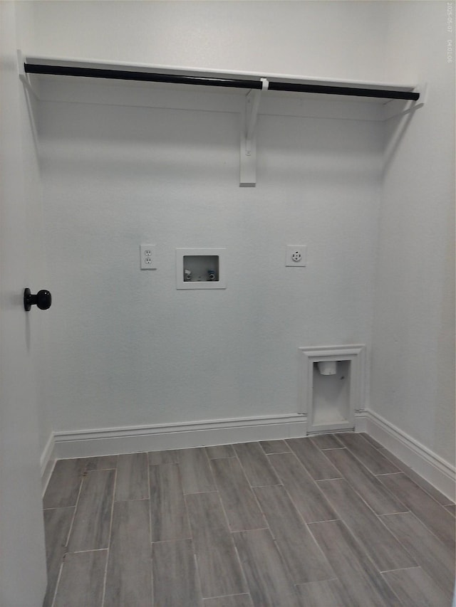 6025 Melanie Dr, Fort Worth, TX 76131 - laundry area featuring hookup for an electric dryer, baseboards, wood tiled floors, and washer hookup