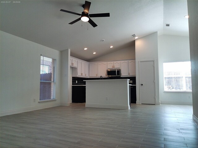 6025 Melanie Dr, Fort Worth, TX 76131 - kitchen featuring stainless steel microwave, open floor plan, vaulted ceiling, ceiling fan, and recessed lighting