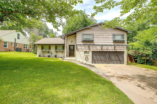 3554 Cromart Ct N, Fort Worth, TX 76133 - split level home with a garage, concrete driveway, brick siding, and cooling unit