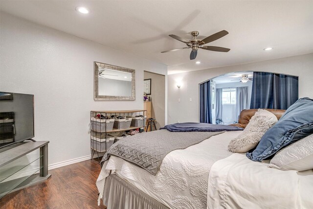 3554 Cromart Ct N, Fort Worth, TX 76133 - bedroom featuring arched walkways, wood finished floors, recessed lighting, baseboards, and a ceiling fan