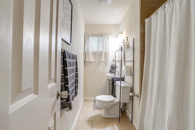 3554 Cromart Ct N, Fort Worth, TX 76133 - full bathroom featuring a textured wall, toilet, tile patterned floors, baseboards, and a shower with curtain