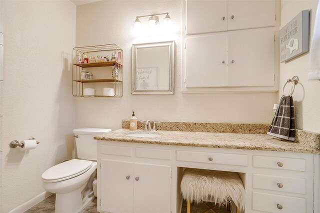 3554 Cromart Ct N, Fort Worth, TX 76133 - bathroom with toilet, vanity, and baseboards