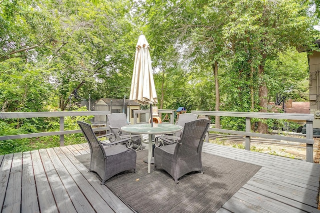 3554 Cromart Ct N, Fort Worth, TX 76133 - deck with outdoor dining space and view of wooded area