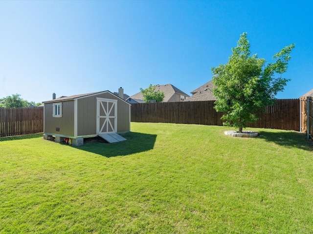 view of yard featuring a storage shed and an outbuilding