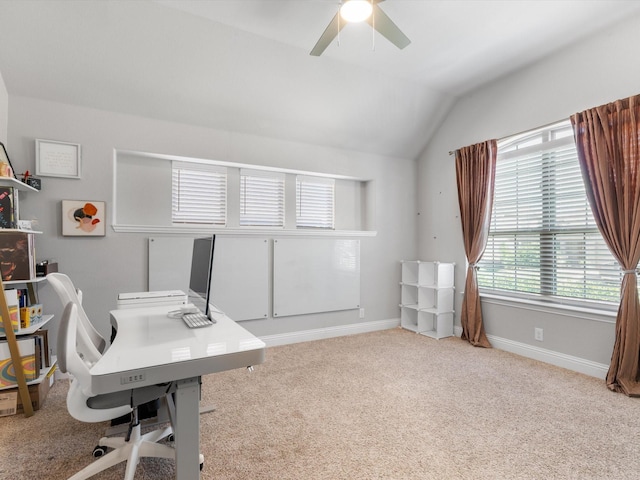 office area with lofted ceiling, carpet, a ceiling fan, and baseboards