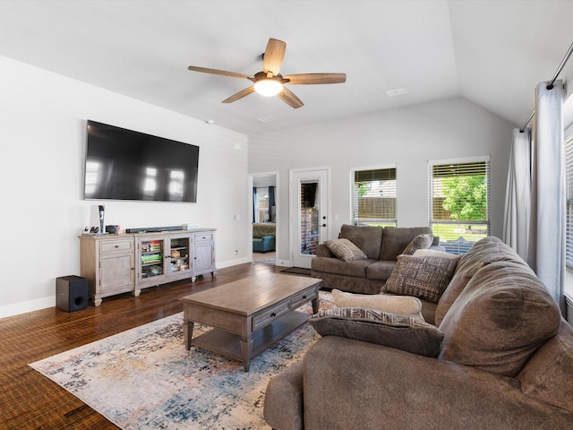 living room with ceiling fan, baseboards, wood finished floors, and vaulted ceiling