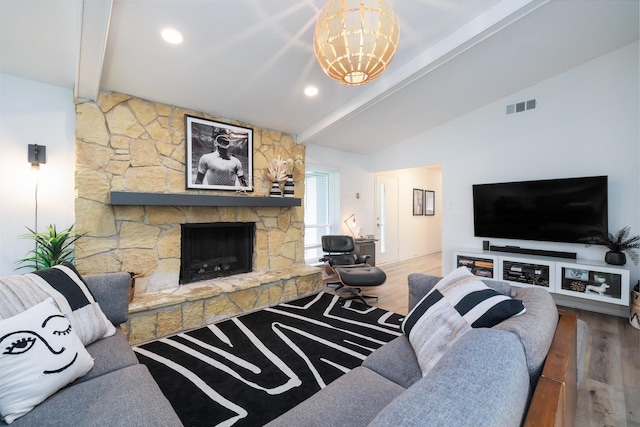 4940 Ashbrook Rd, Dallas, TX 75227 - living area with wood finished floors, a stone fireplace, and a chandelier
