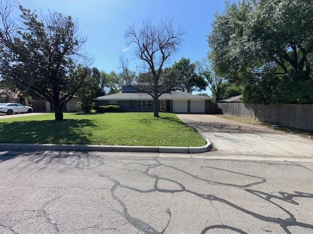 ranch-style house with driveway and a garage