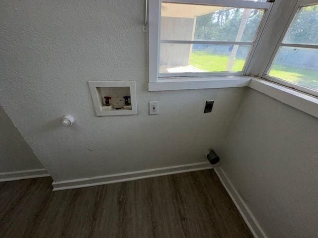 clothes washing area with hookup for an electric dryer, washer hookup, wood finished floors, and baseboards