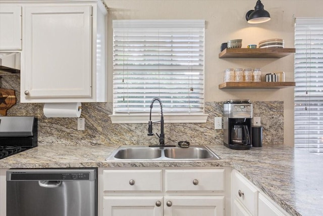 401 Mahon Hollow Dr, Waco, TX 76704 - kitchen featuring dishwasher, a sink, decorative backsplash, and white cabinets