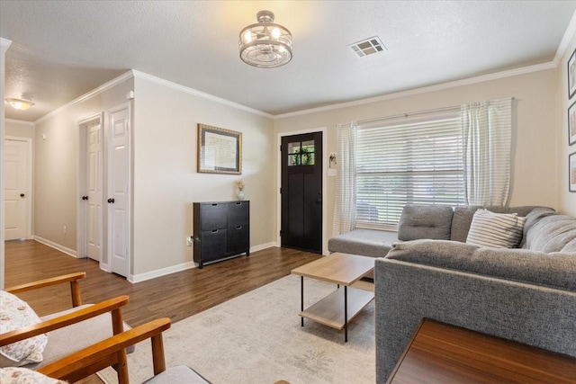 401 Mahon Hollow Dr, Waco, TX 76704 - living room featuring crown molding, dark wood finished floors, baseboards, and a textured ceiling