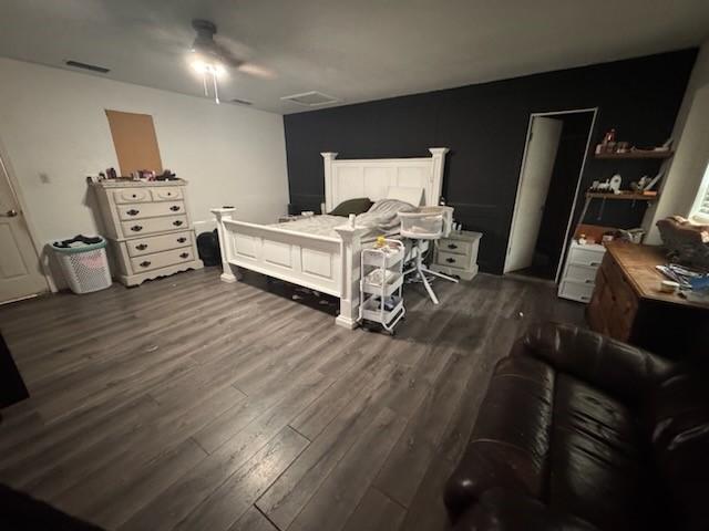 261 Barker St, Stephenville, TX 76401 - bedroom with dark wood-style flooring and a ceiling fan