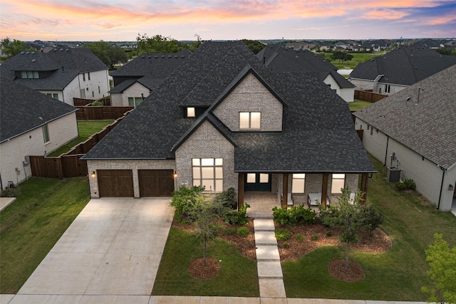 4541 Walnut Grove Ln, Prosper, TX 75078 - french country inspired facade with driveway, an attached garage, a residential view, and roof with shingles
