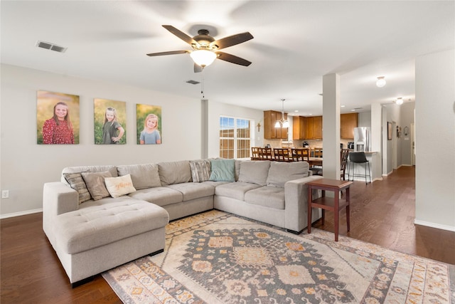 1915 Fairway Crossing Rd, Wylie, TX 75098 - living room featuring a ceiling fan, baseboards, wood finished floors, and a chandelier