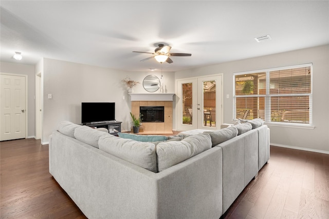 1915 Fairway Crossing Rd, Wylie, TX 75098 - living area featuring ceiling fan, baseboards, a tile fireplace, and dark wood-type flooring