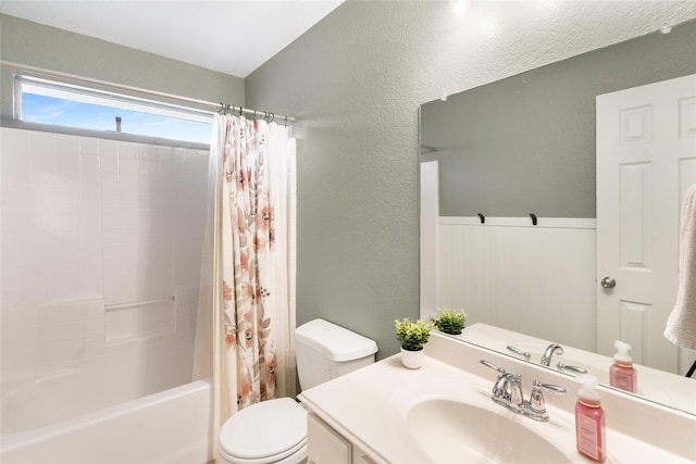1915 Fairway Crossing Rd, Wylie, TX 75098 - bathroom with a textured wall, toilet, vanity, and shower / bathtub combination with curtain