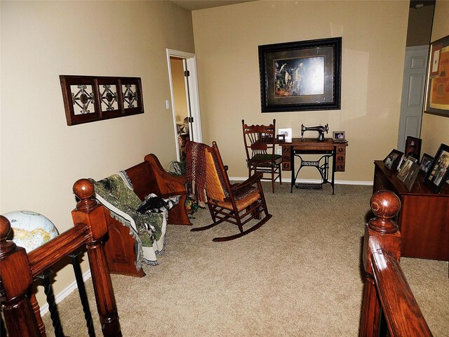 carpeted living room with baseboards
