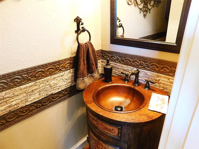 bathroom featuring backsplash and vanity