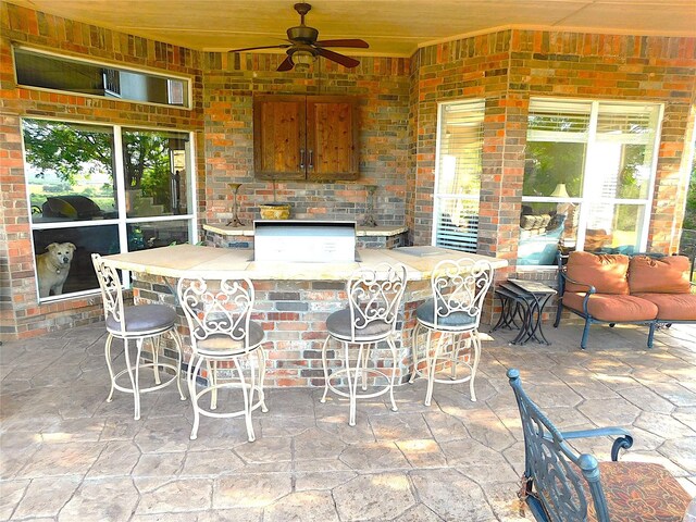 view of patio / terrace with ceiling fan