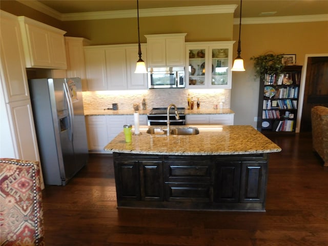 kitchen featuring stainless steel appliances, dark wood finished floors, white cabinetry, and ornamental molding