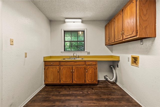979 Rockdale, Sulphur Springs, TX 75482 - clothes washing area with hookup for a washing machine, a textured ceiling, cabinet space, dark wood-style flooring, and baseboards