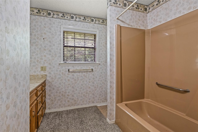 979 Rockdale, Sulphur Springs, TX 75482 - full bathroom with vanity, baseboards, and a textured ceiling