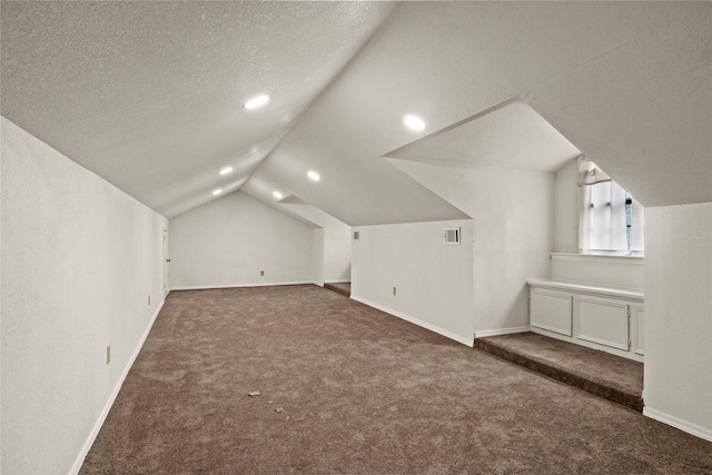 979 Rockdale, Sulphur Springs, TX 75482 - additional living space featuring carpet flooring, vaulted ceiling, a textured ceiling, baseboards, and recessed lighting