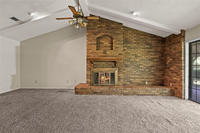 979 Rockdale, Sulphur Springs, TX 75482 - unfurnished living room with ceiling fan, carpet floors, a textured ceiling, a brick fireplace, and brick wall