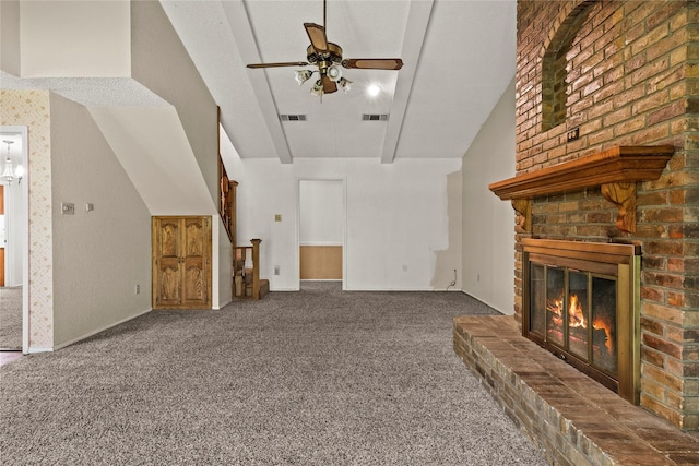 979 Rockdale, Sulphur Springs, TX 75482 - unfurnished living room featuring carpet, vaulted ceiling, ceiling fan, a fireplace, and baseboards