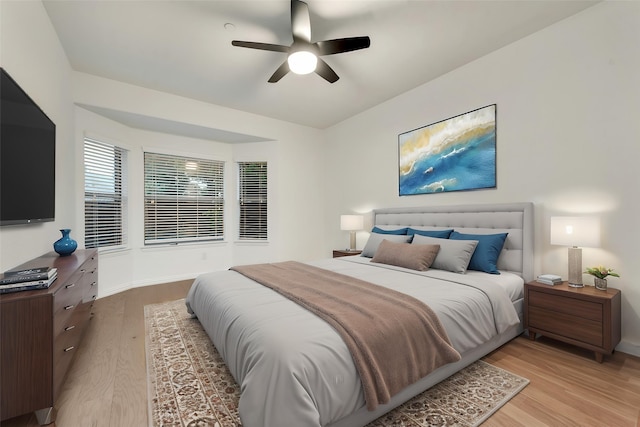 305 Blythe Bridge Dr, Roanoke, TX 76262 - bedroom with light wood-style flooring, baseboards, and a ceiling fan