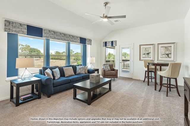 living room with lofted ceiling, a ceiling fan, baseboards, and carpet floors