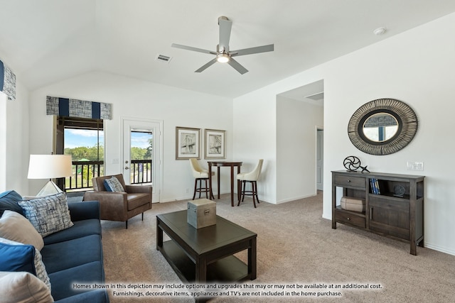living room featuring a ceiling fan, visible vents, carpet floors, and vaulted ceiling