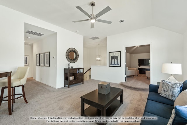 carpeted living area with lofted ceiling, ceiling fan, and baseboards