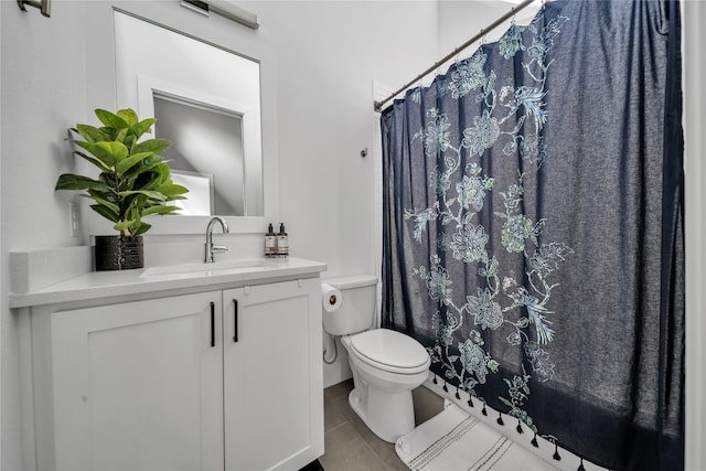 bathroom with toilet, vanity, and a shower with shower curtain