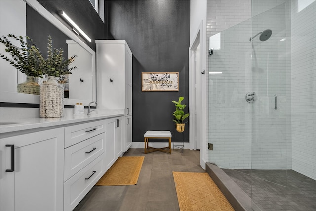 full bath with a shower stall, wood finished floors, and vanity