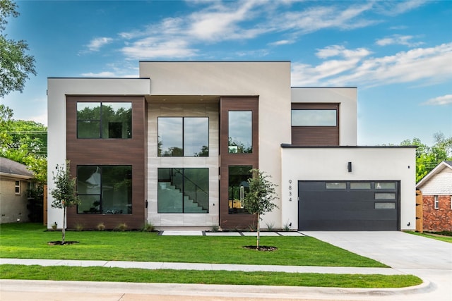 9834 Shoreview Rd, Dallas, TX 75238 - contemporary home featuring concrete driveway, a front lawn, and stucco siding