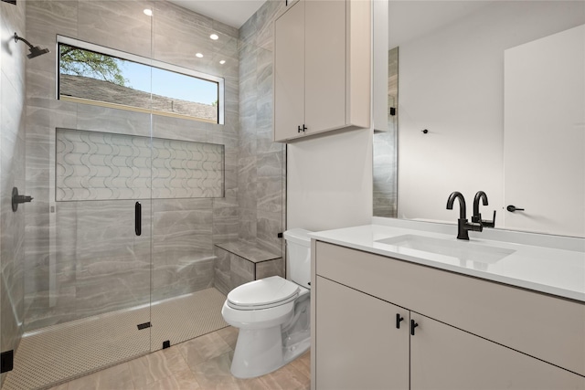 9834 Shoreview Rd, Dallas, TX 75238 - bathroom with a tile shower, double vanity, and recessed lighting