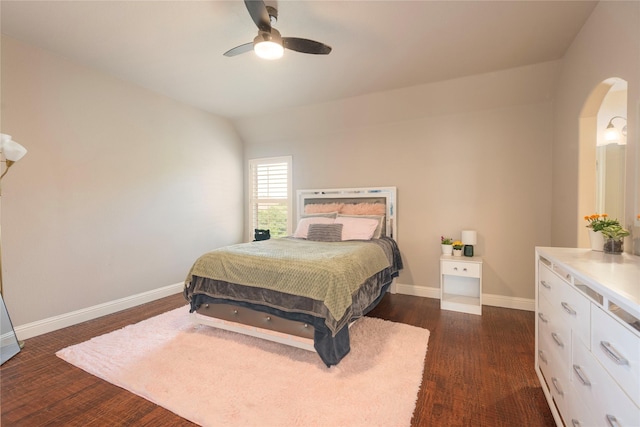 4016 Muscovy Dr, Mckinney, TX 75072 - bedroom featuring arched walkways, baseboards, dark wood-type flooring, and ceiling fan