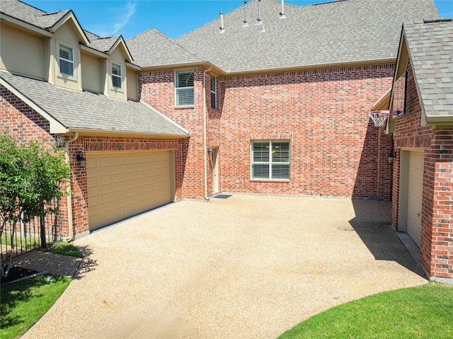 4016 Muscovy Dr, Mckinney, TX 75072 - view of front of property featuring a shingled roof, concrete driveway, brick siding, and stucco siding