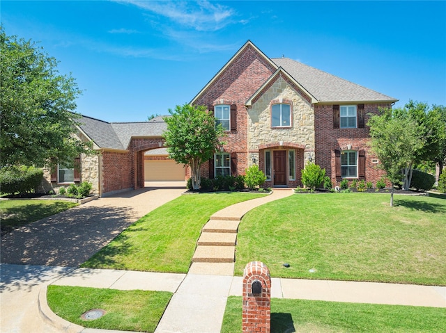 4016 Muscovy Dr, Mckinney, TX 75072 - view of front facade featuring driveway, an attached garage, brick siding, and a front yard
