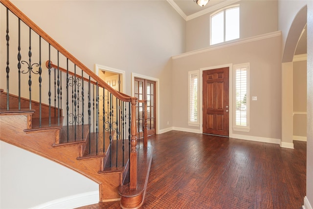4016 Muscovy Dr, Mckinney, TX 75072 - entryway with arched walkways, healthy amount of natural light, baseboards, ornamental molding, and stairs