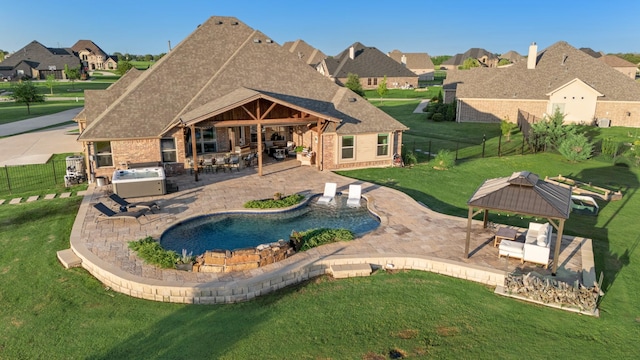 308 Pioneer Ct, Mclendon Chisholm, TX 75032 - back of house with a gazebo, a hot tub, brick siding, a patio, and a residential view