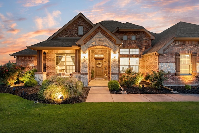 308 Pioneer Ct, Mclendon Chisholm, TX 75032 - french country home with brick siding, a yard, and a shingled roof