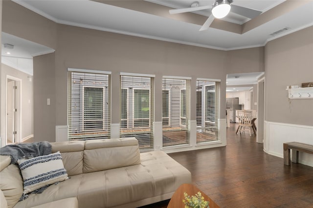 7610 Bantry Cir, Dallas, TX 75248 - living area featuring crown molding, a ceiling fan, dark wood-type flooring, wainscoting, and a towering ceiling