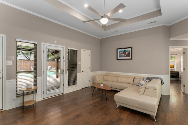 7610 Bantry Cir, Dallas, TX 75248 - living area featuring ceiling fan, dark wood finished floors, a wainscoted wall, crown molding, and a raised ceiling