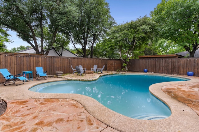 7610 Bantry Cir, Dallas, TX 75248 - view of pool with a patio, a fenced backyard, and a fire pit