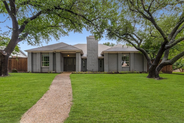 7610 Bantry Cir, Dallas, TX 75248 - view of front of house with a chimney, brick siding, and a shingled roof